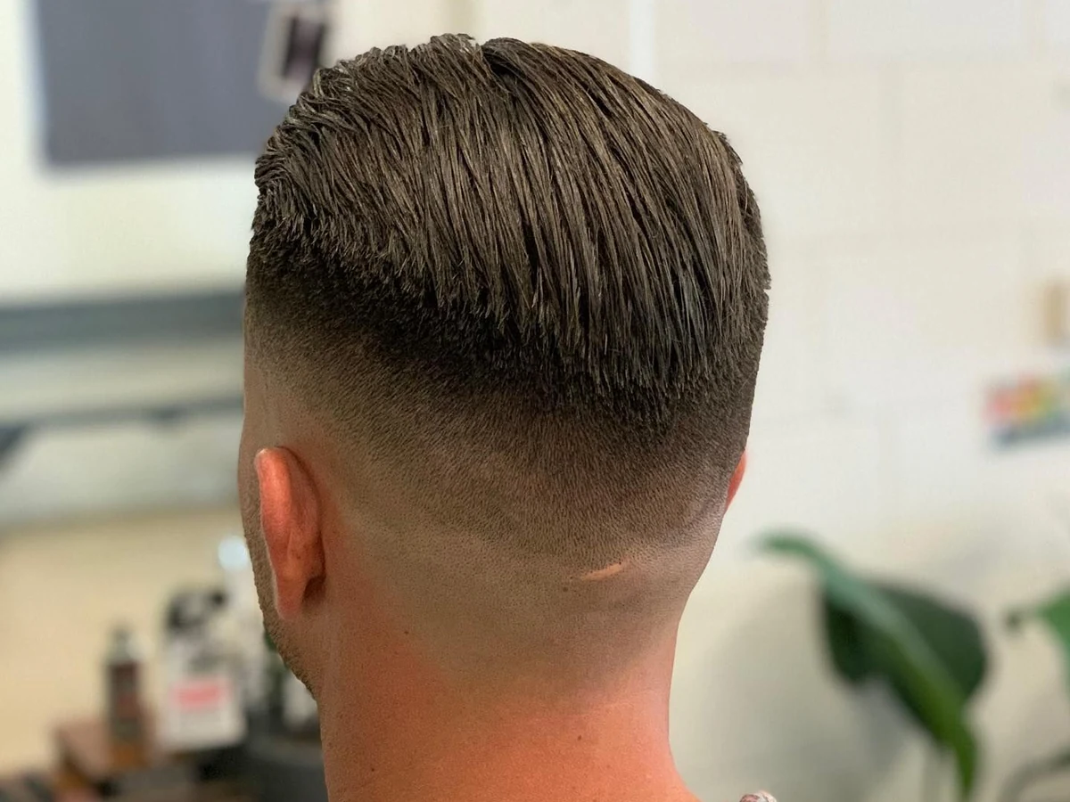 Sharp faded haircut finished at Eagle Tamer Barbershop in Stratford